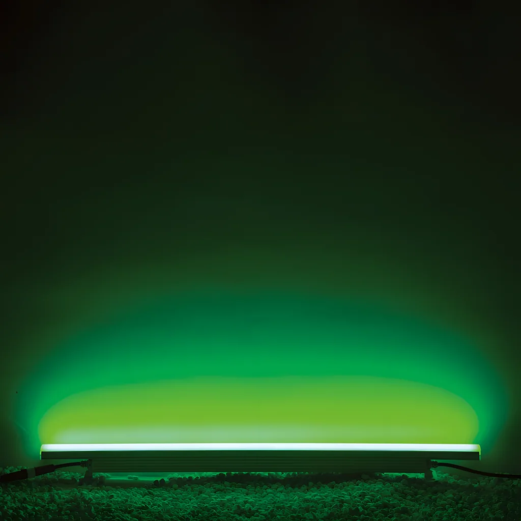 Illustrative application photo: Green wall-wash from a ground-mounted linear light, wider spread.