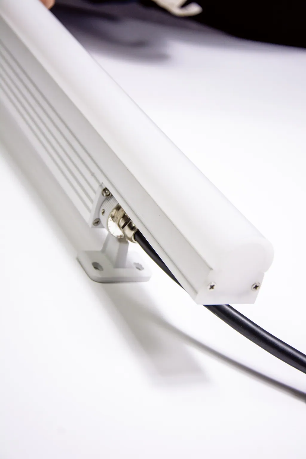 Bar on its die-cast bracket with cable entry, white background.