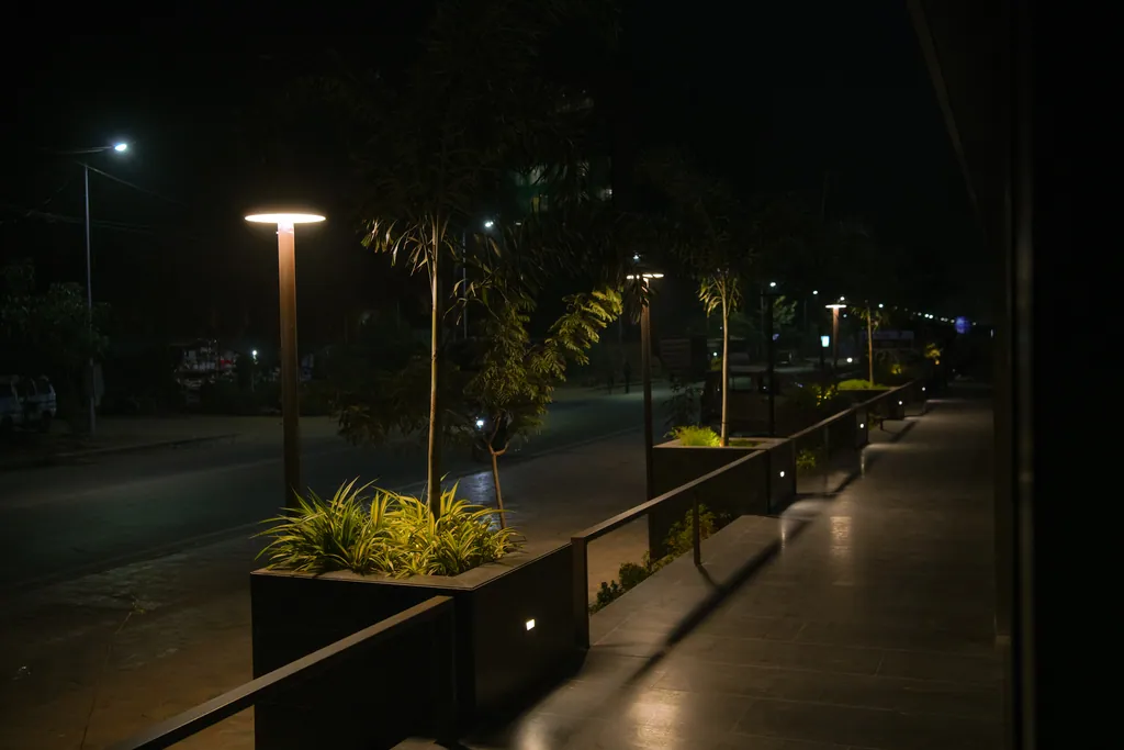 Disc post tops along the planted walkway at AWS-3 Commercial Tower