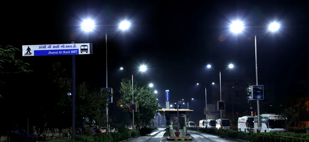 Street lights along the road beside the Jhansi Ki Rani BRTS station at night