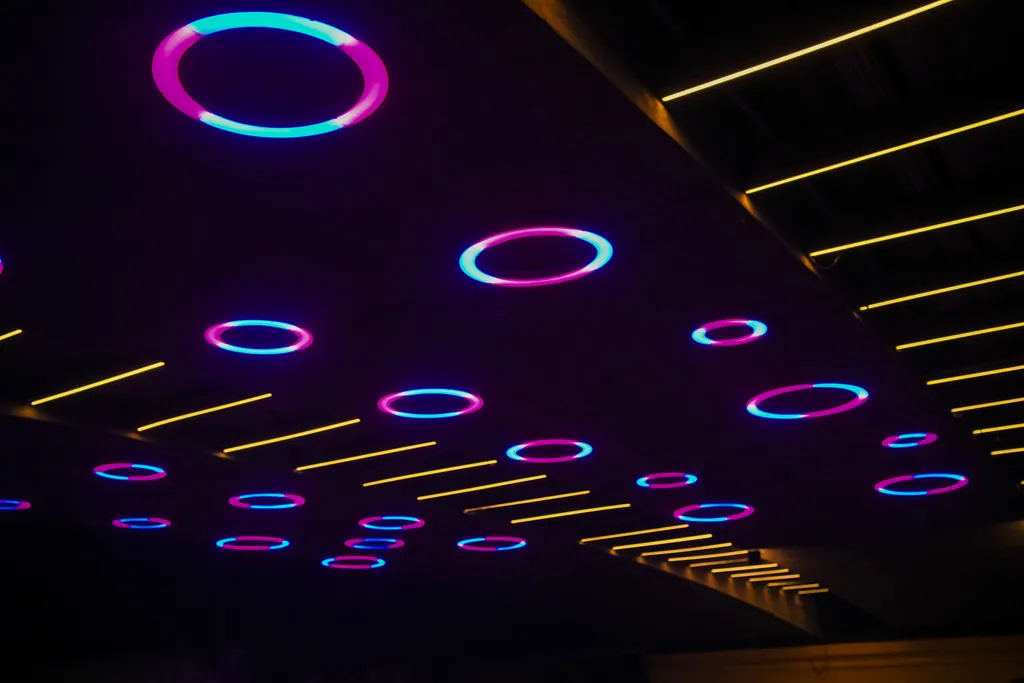 Close view of rings glowing magenta and cyan on the underside of the bridge
