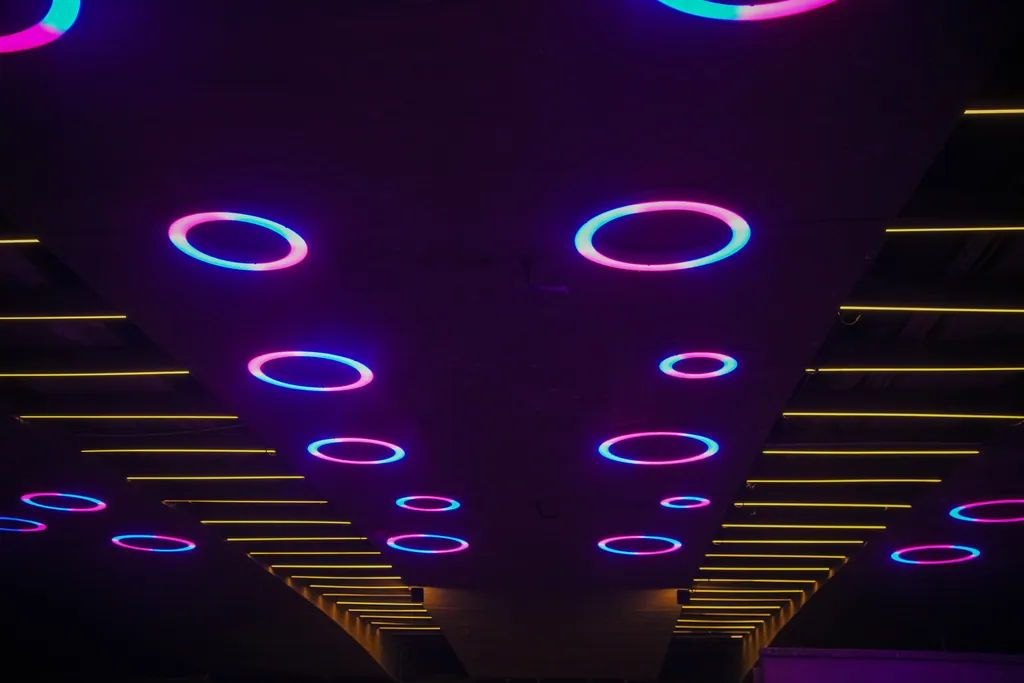Two rows of rings along the centre of the bridge soffit, framed by warm linear lights