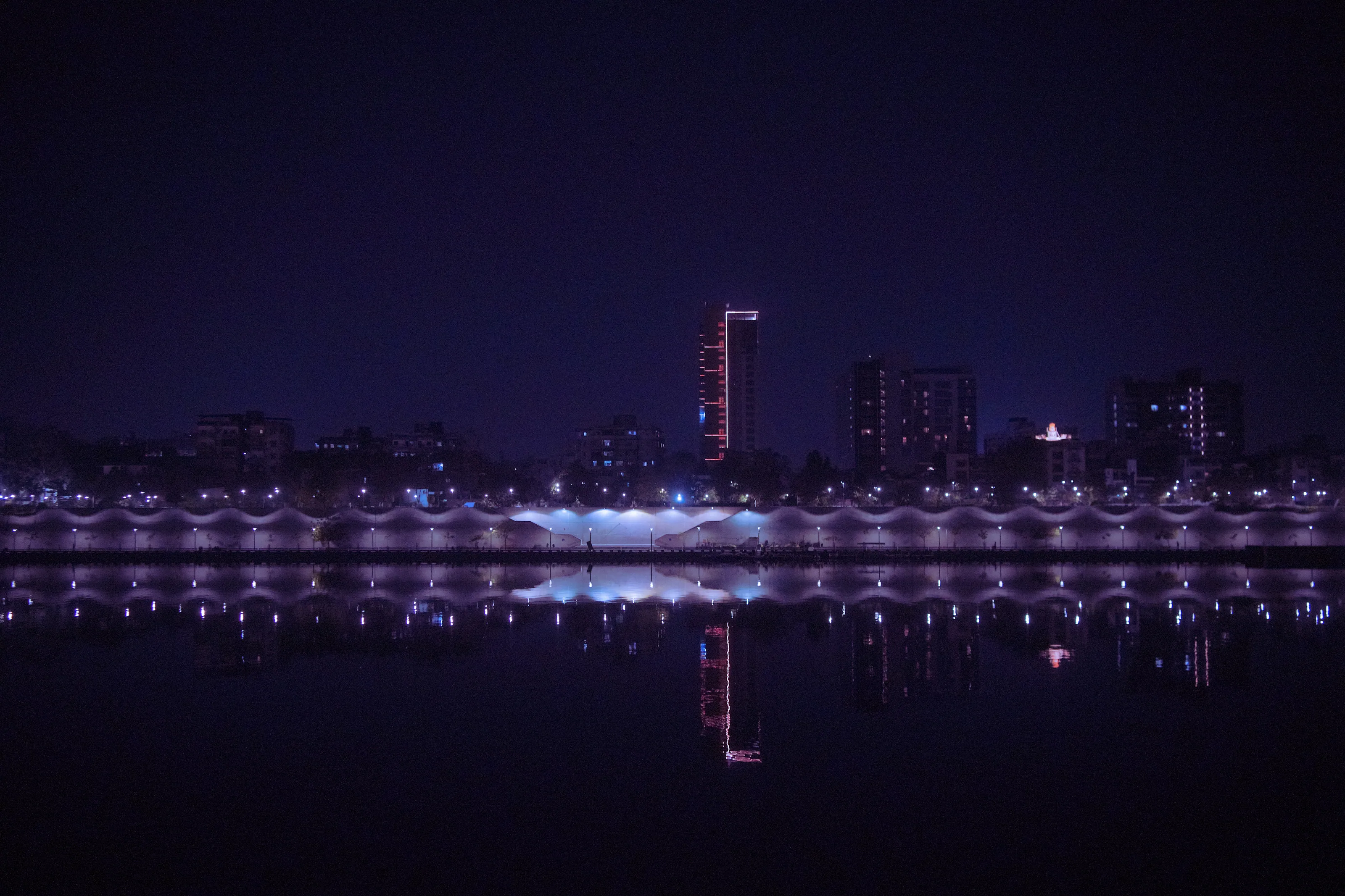The riverfront at night, seen across the Sabarmati.